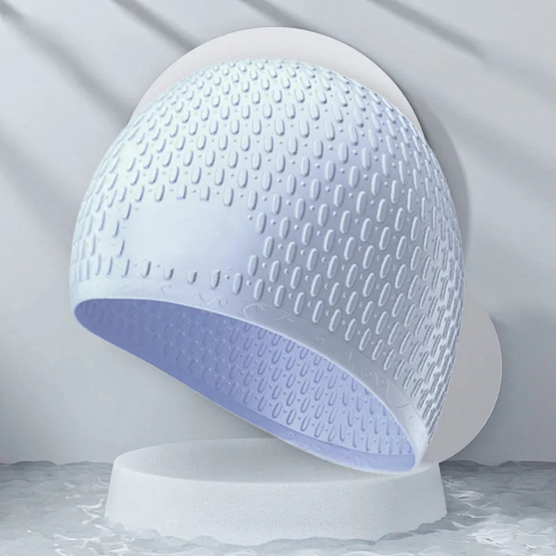 Silicone adult swimming cap with water drop pattern in solid colour options.
