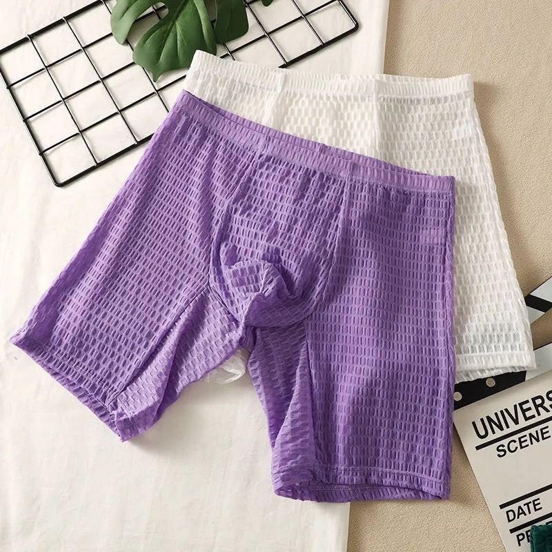 Men's white lace boxer shorts with lengthened hip lifting shaping design on a neutral background