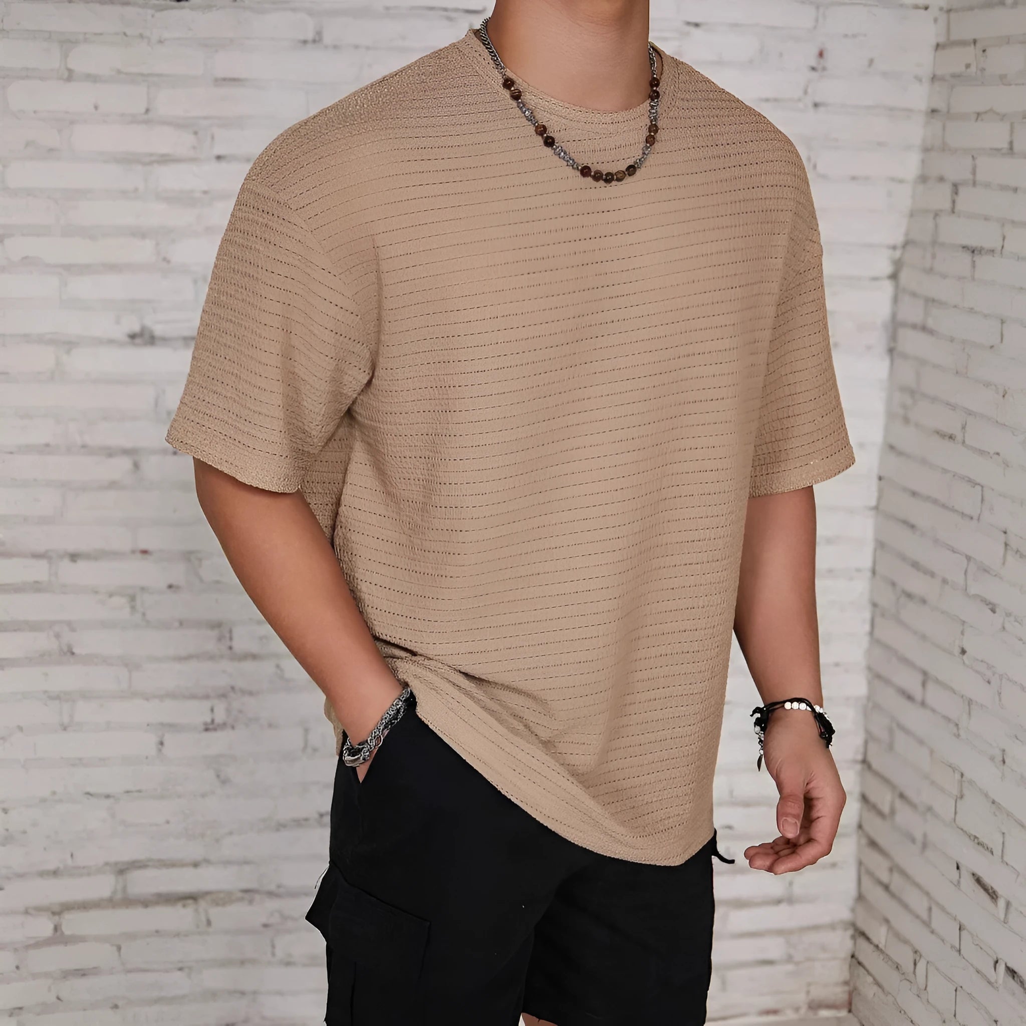 Men's slim fit solid colour T-shirt in light blue, showing round neck and short sleeves