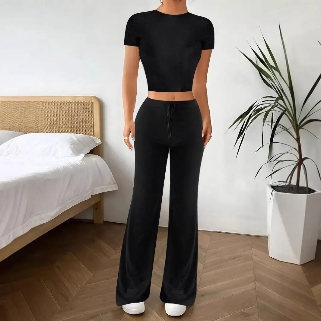 Black women's co-ord suit with high-waist trousers and a short-sleeve T-shirt on a hanger.
