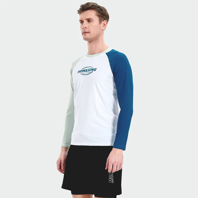 Men's white long-sleeved swim top with matching blue double-layer swim trunks on a beach.