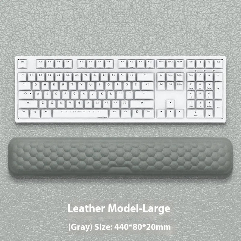 Grey and black memory foam mouse wrist pads with silicone bases, shown in cloth and leather cover options.