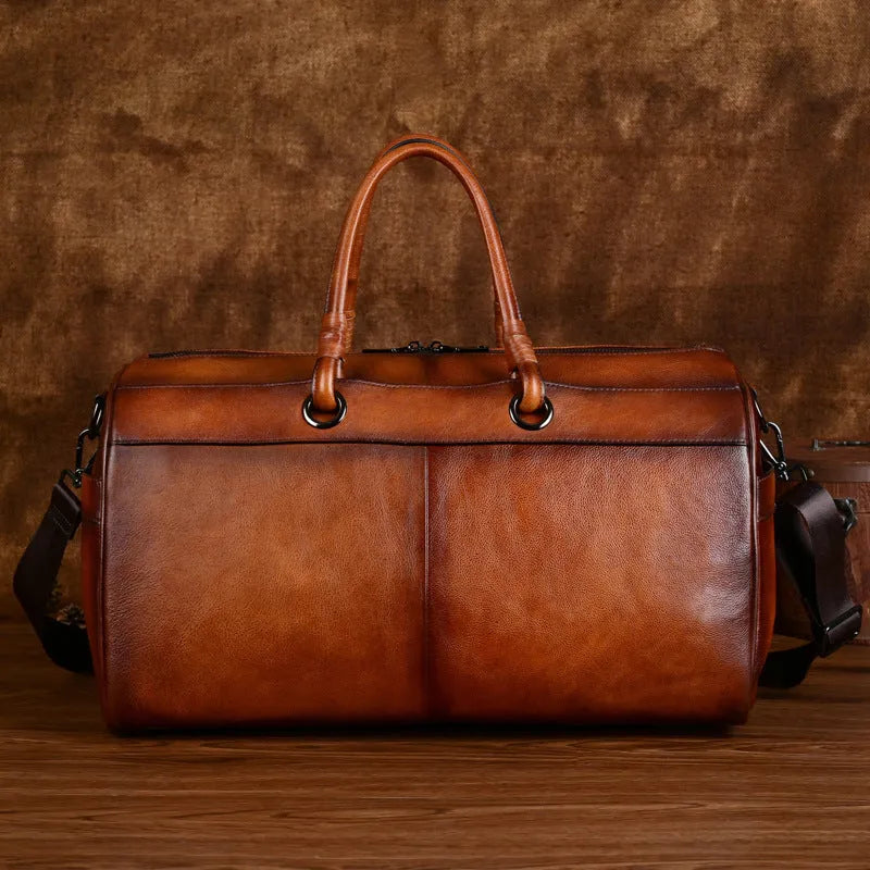 Handmade retro style brown leather shoulder bag with large capacity.
