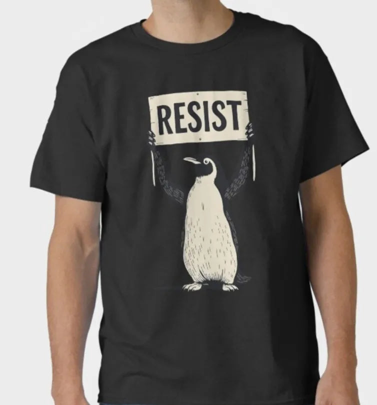 A loose-fitting black short-sleeved cotton t-shirt with a round neck on a hanger.