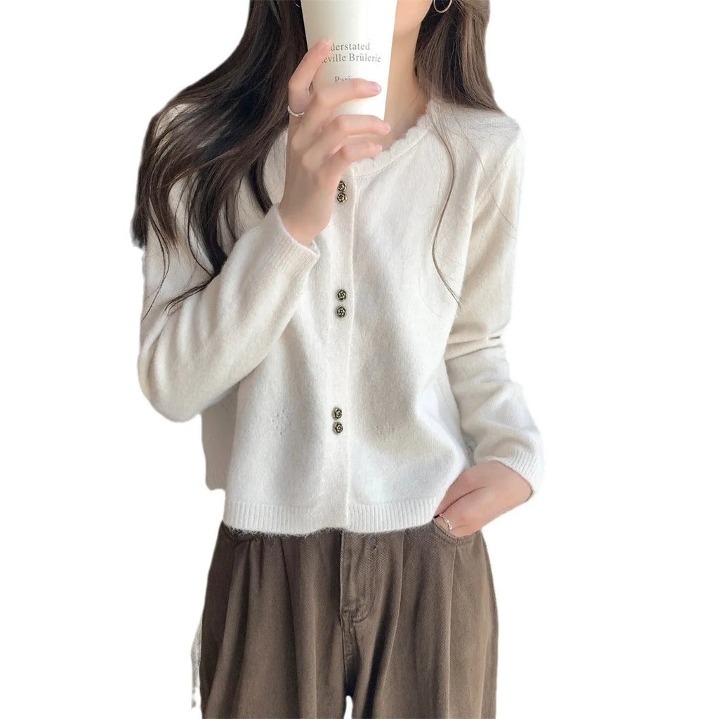 Women's long-sleeved acrylic cardigan sweater in milky white, shown with front open.