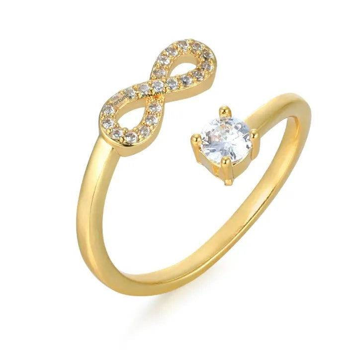Geometric personality ring with engraved letter and inlaid zircon stones in metallic finish
