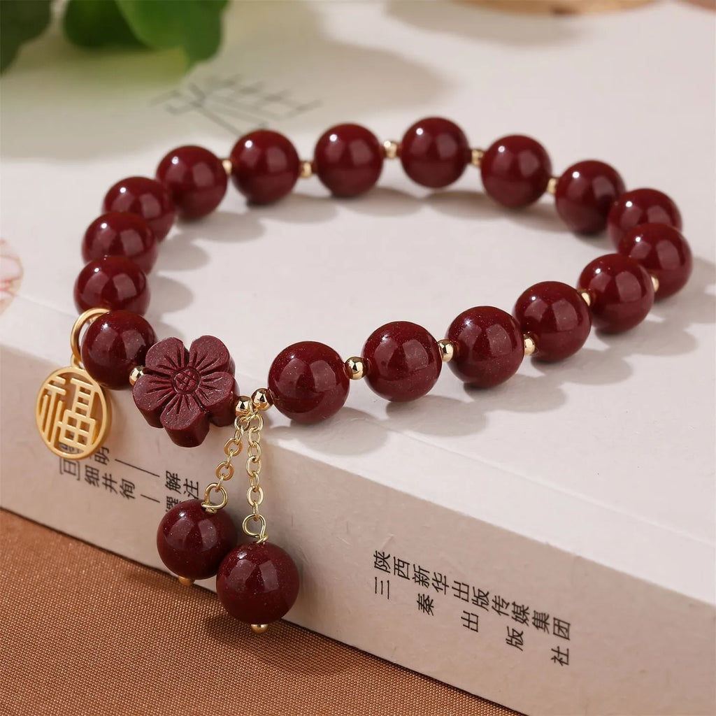 Women's cinnabar national style bracelet with purple gold sand finish and Fu character peach blossom charm