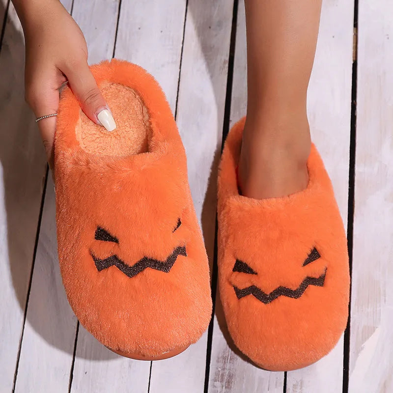 Orange Halloween pumpkin slippers with plush lining and textured coral velvet uppers