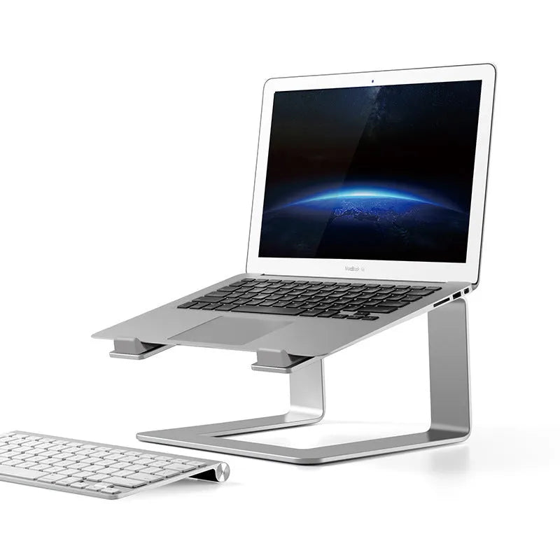 Black aluminium alloy laptop stand on a desk, showing its raised platform and dimensions.