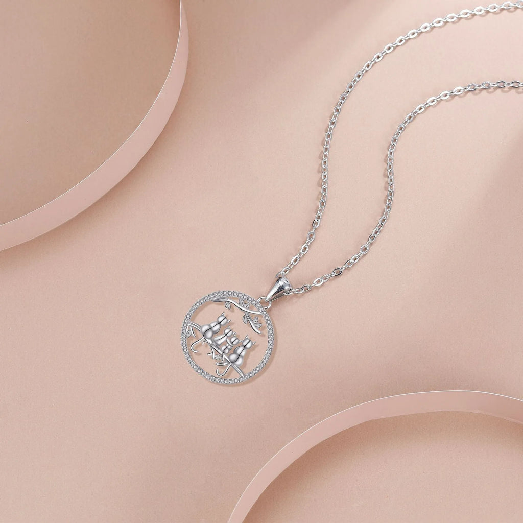 Women's copper necklace with four kitten pendants on cross chain