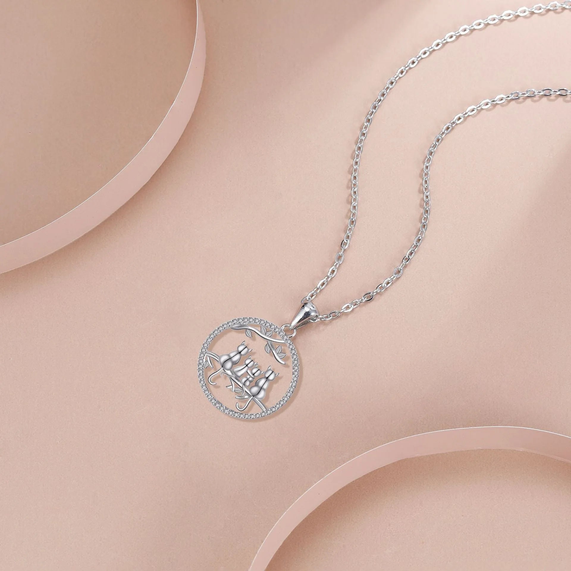 Women's copper necklace with four kitten pendants on cross chain