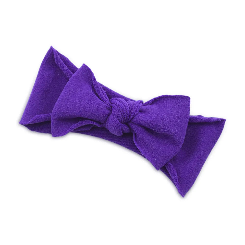 Solid colour knotted cloth headband for baby girls with bowknot design, available in 37 colours