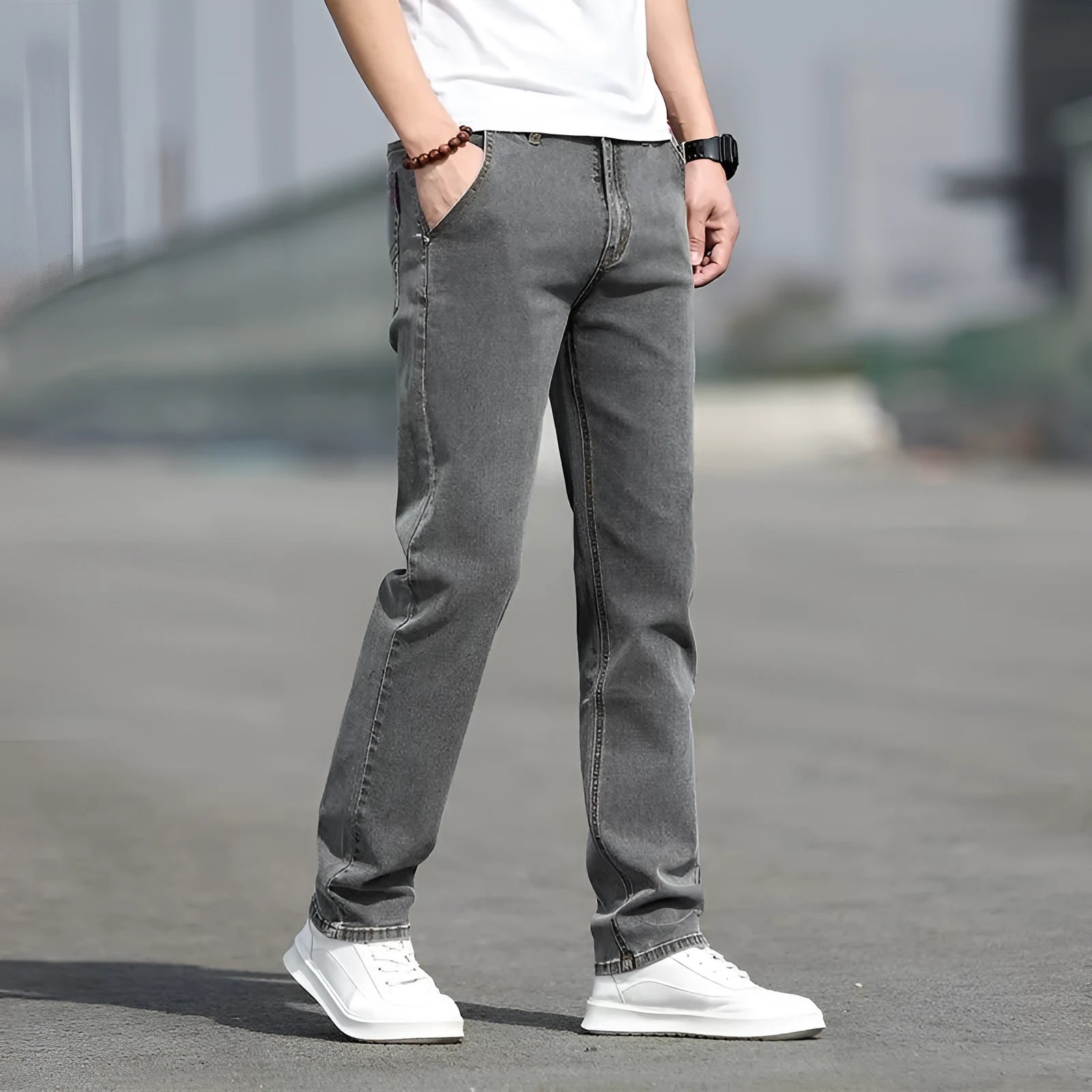 Men's straight-leg smoky gray jeans with low-rise waist and zip fly.