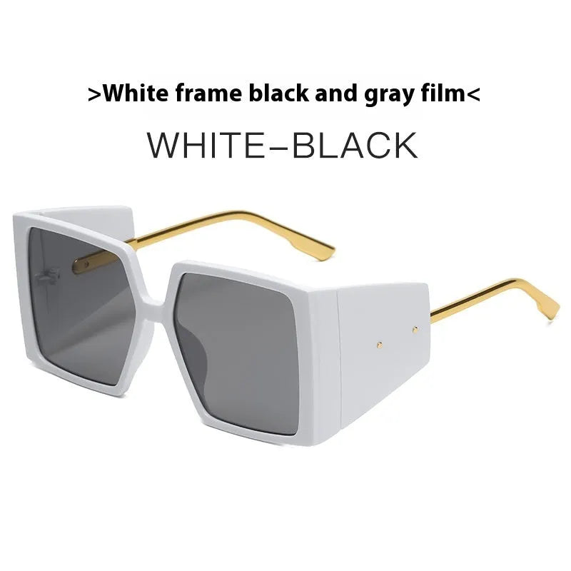 A pair of large square frame sunglasses on a white background, showing the oversized silhouette.
