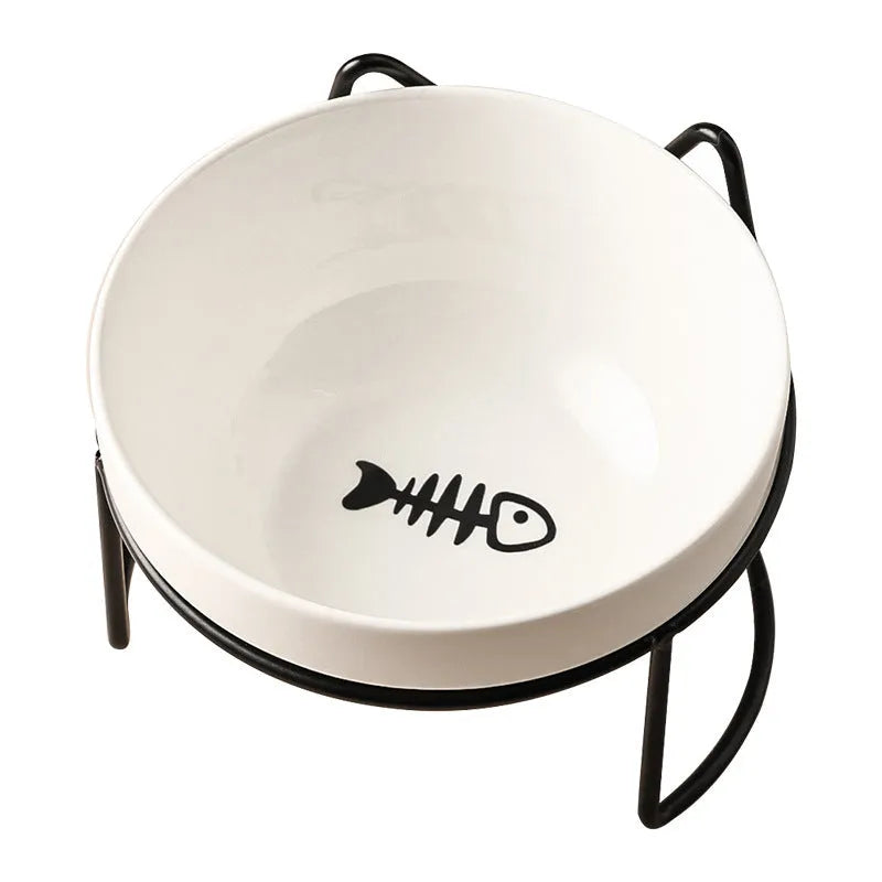 White ceramic pet bowl with cat footprints design in a black iron frame.