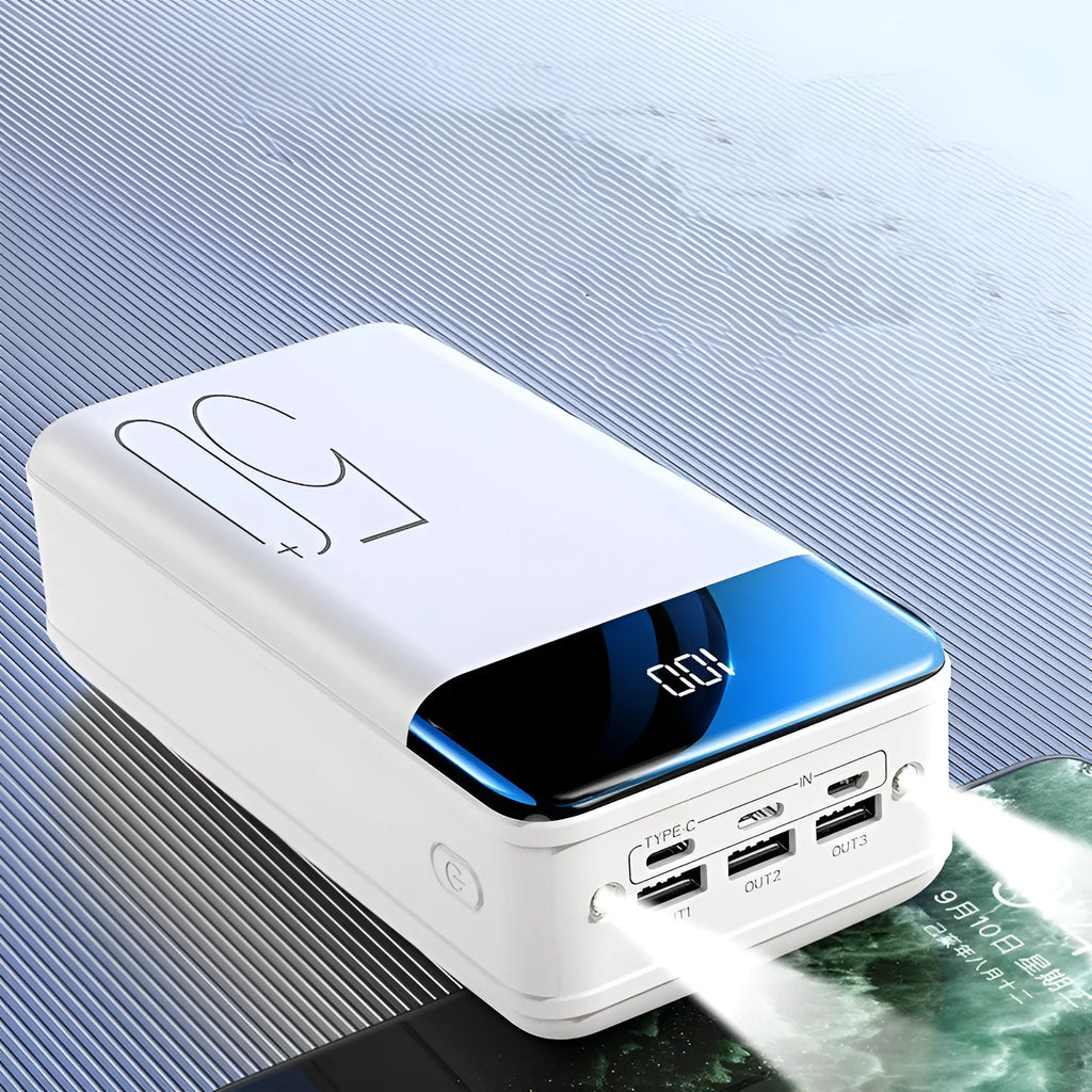 Black and white large capacity 50000mAh power bank with multiple USB ports for charging.