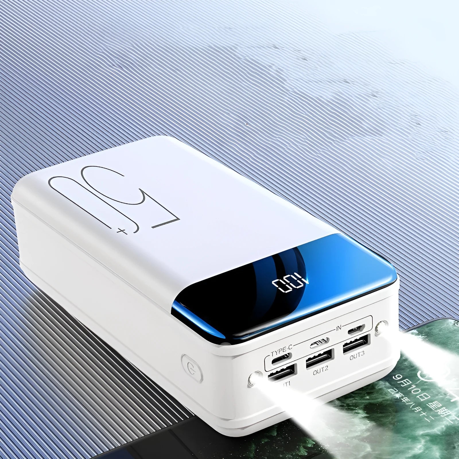 Black and white large capacity 50000mAh power bank with multiple USB ports for charging.
