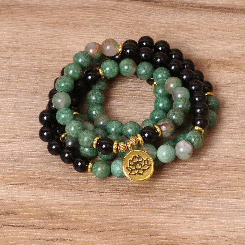 Green and black elastic beaded long bracelet made from alloy material.