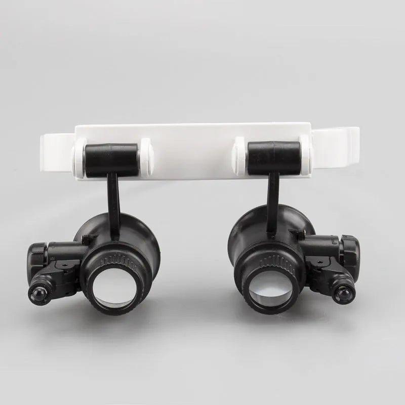 White foldable head-mounted magnifying glass with LED light for clock repair and precision inspection work