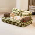 Fluffy cat couch bed in black and white with raised sides and non-slip base for cats and small dogs