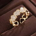 Adjustable geometric love heart couples ring in gold colour on small finger