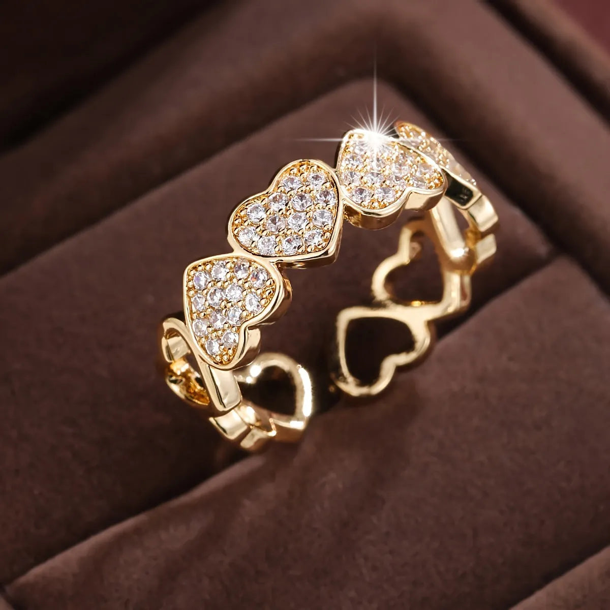 Adjustable geometric love heart couples ring in gold colour on small finger