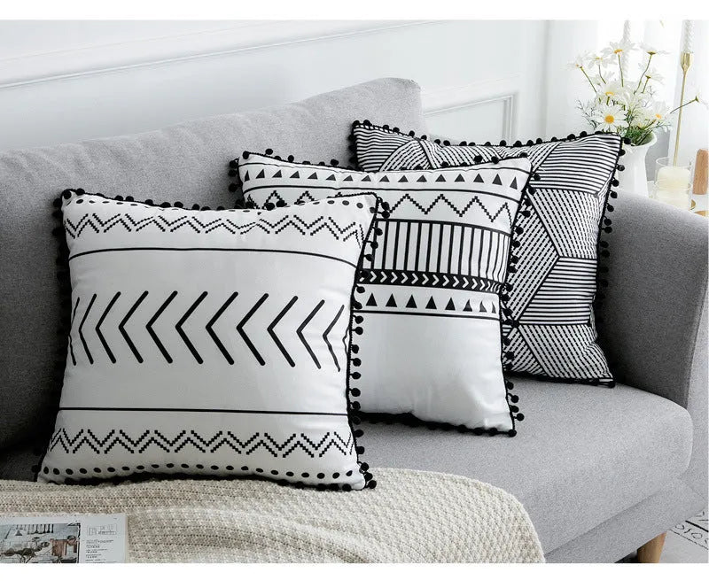 Bohemian style throw pillow on a sofa, available in light grey, black, or white, shown in 45x45cm size.