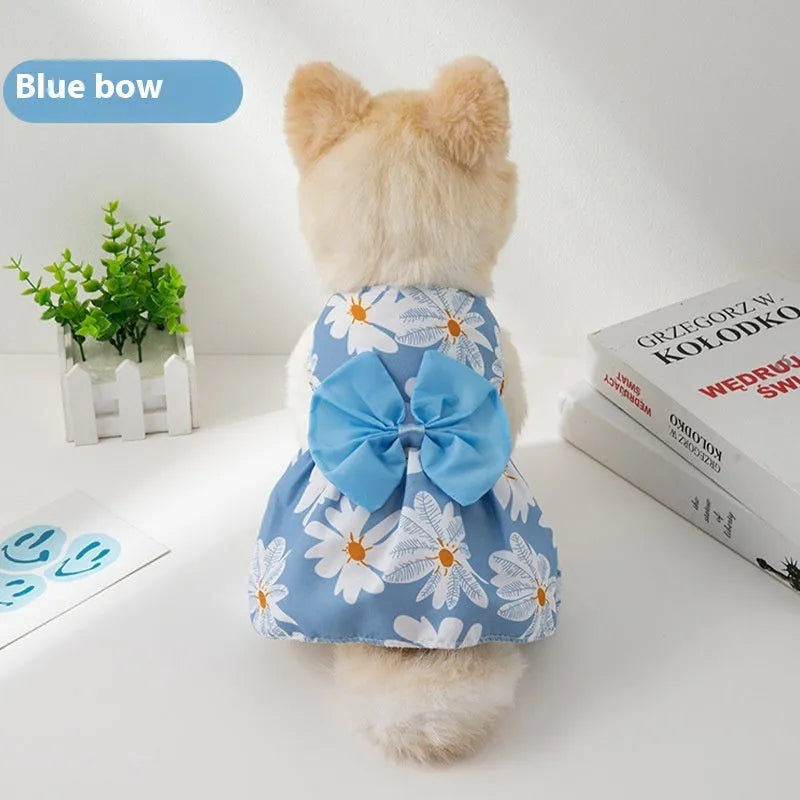 Orange floral butterfly pet dress with a bow on a dog, showing thin summer clothing.