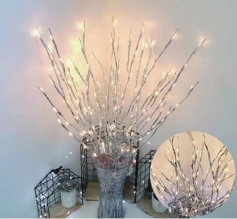 LED decorative tree light in a vase with silver branches illuminated in a choice of six colours.