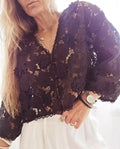 Women's black lace V-neck blouse with three-dimensional white floral decoration and long sleeves