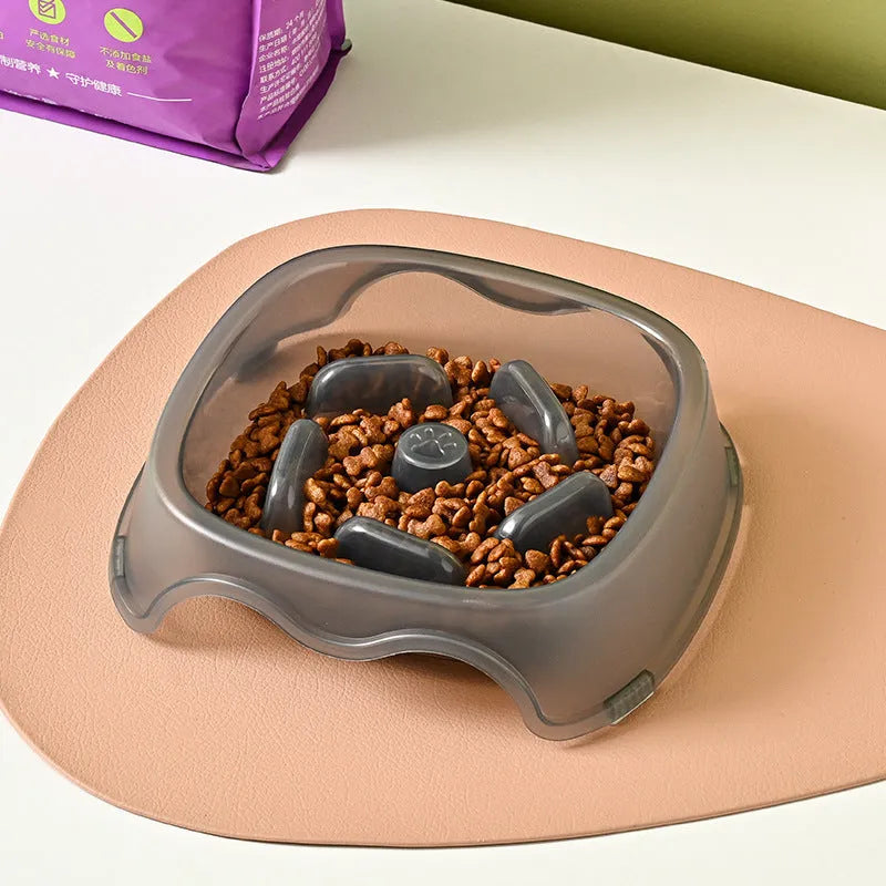 Blue plastic slow feeder dog bowl with anti-choking design on a white background