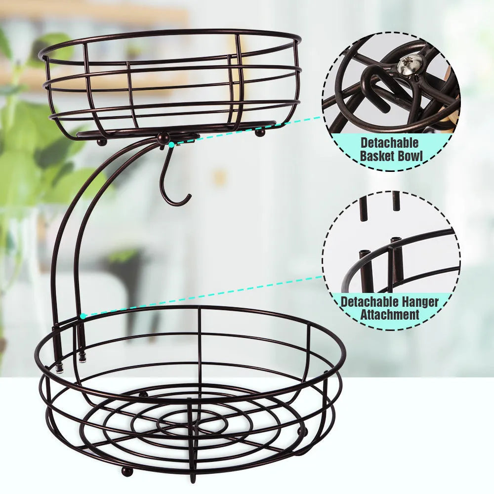 Black double-layer wrought iron fruit basket with open-weave shelves for storing produce.