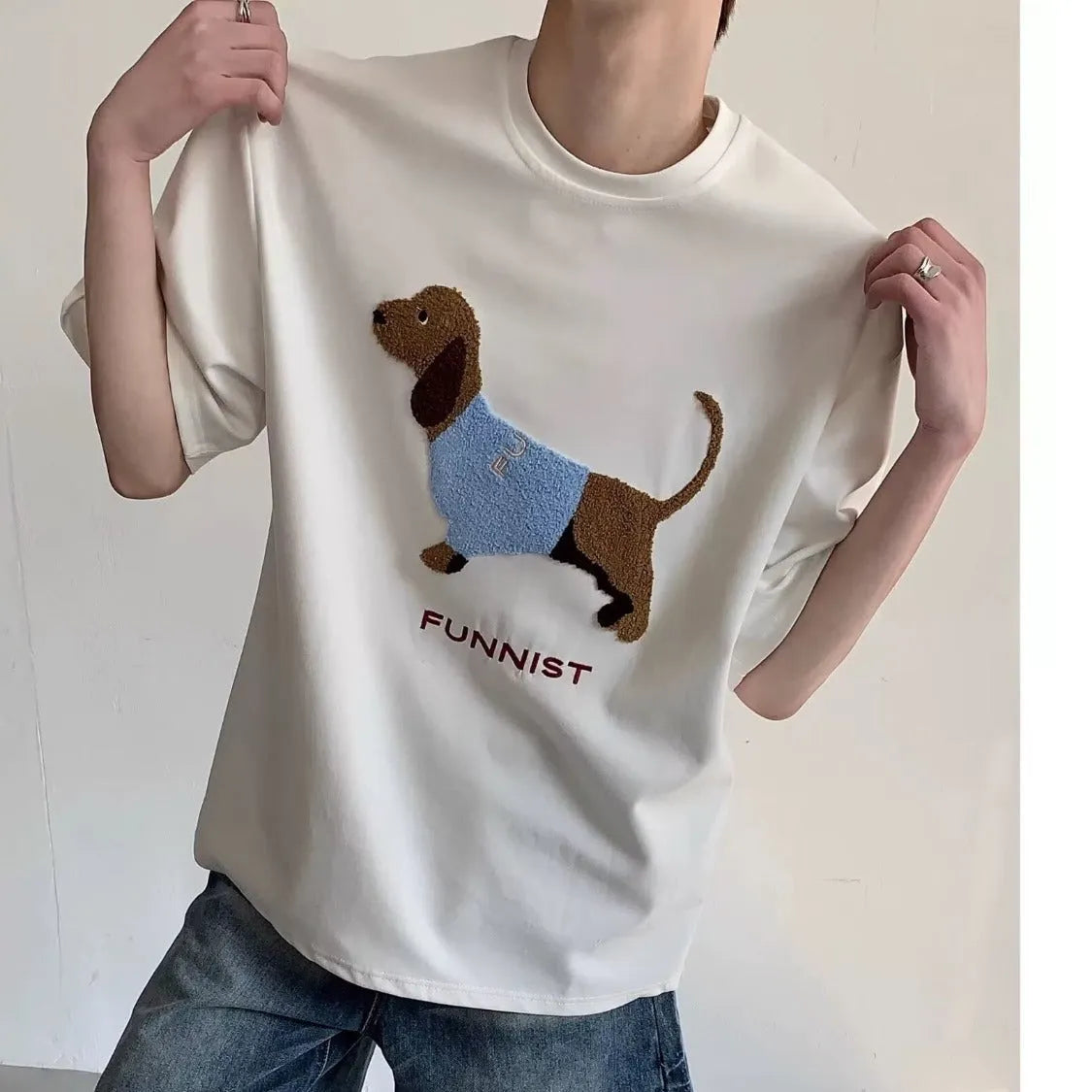 Men's grey cotton T-shirt with an embroidered sausage dog design on the front.