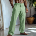 Men's straight leg cotton linen trousers in light green with side pockets and British casual styling
