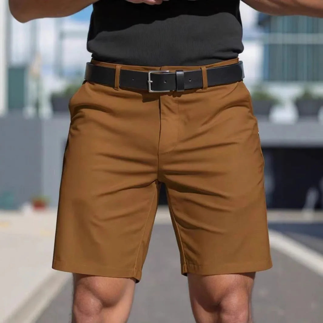 Men's straight cut solid colour shorts in light blue, showing fifth pants length and micro elastic polyester fabric.