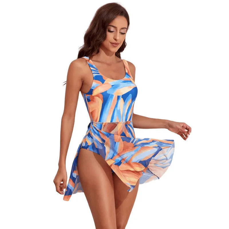 Women's single-shoulder one-piece swimsuit with digital floral print in coconut, colourful and leaves patterns.