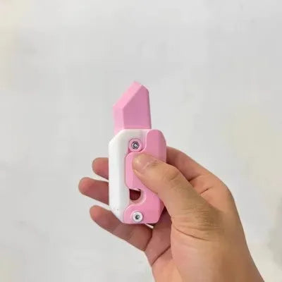Carrot-shaped 3D printed plastic gravity fidget knife with orange purple green colour scheme