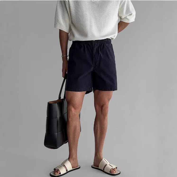 Men's loose fit cotton sports shorts in black, white, or khaki for summer wear