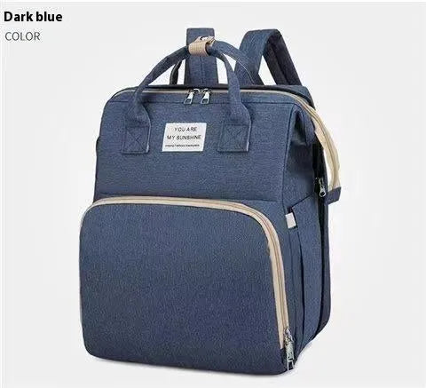 Portable lightweight nylon folding baby changing bag with USB port and shoulder strap in selected colour.