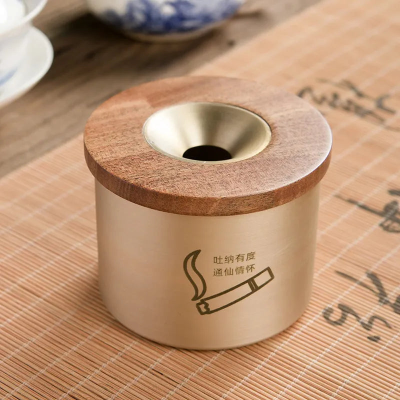 Brass ashtray with wooden lid in retro design for living room decor
