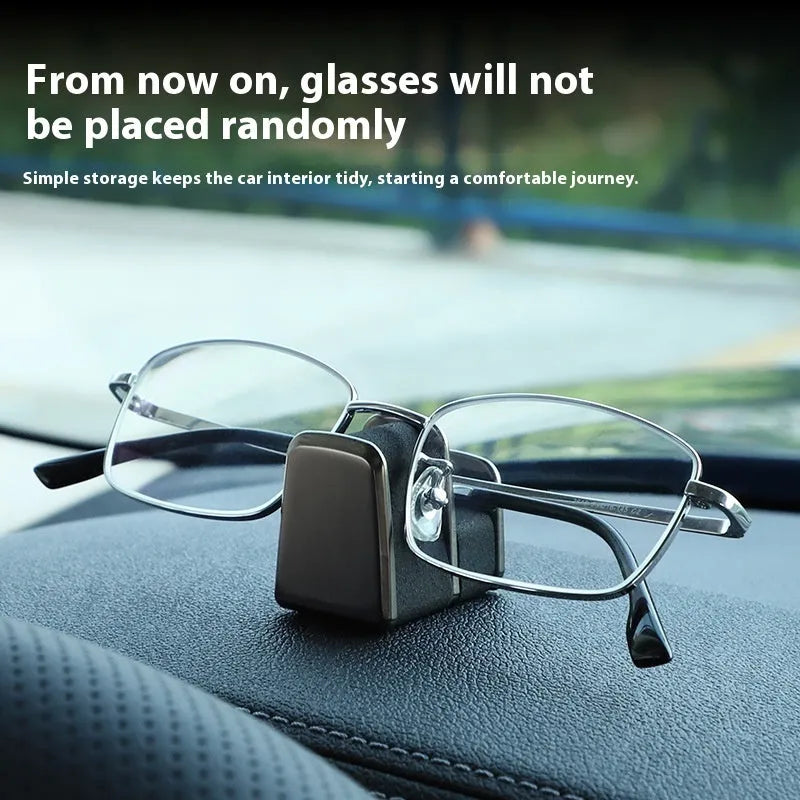 Zinc alloy and leather car dashboard clip for holding glasses in black, grey, green, or red.