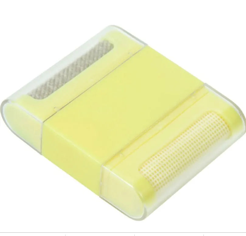 Manual fuzz remover brush with removable catching net for clothes and sofas, compact plastic design