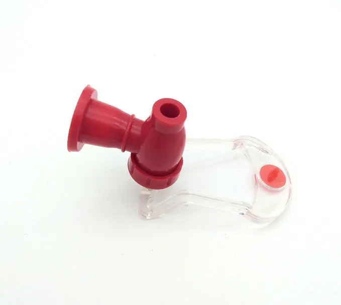 Red plastic Magic Tap soda dispenser attached to 2-litre bottle for push-button pouring
