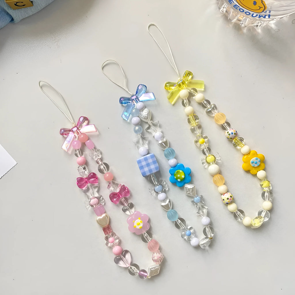 Yellow beaded flower mobile phone lanyard with hand rope design on wrist