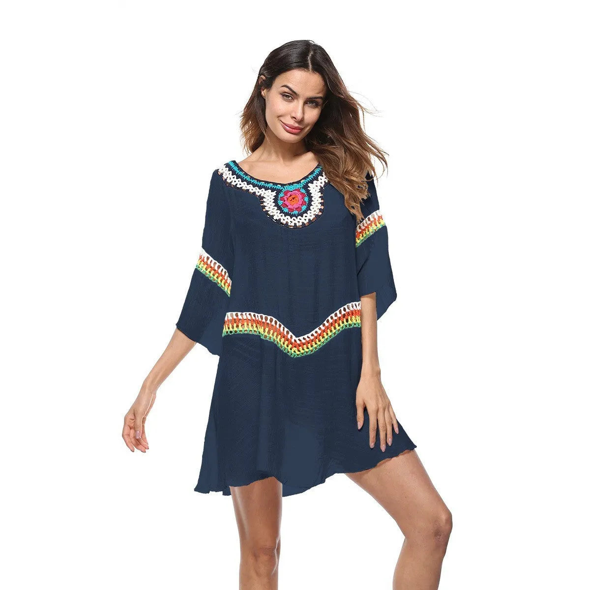 Women's crocheted white beach cover-up top for sun protection during swimming.