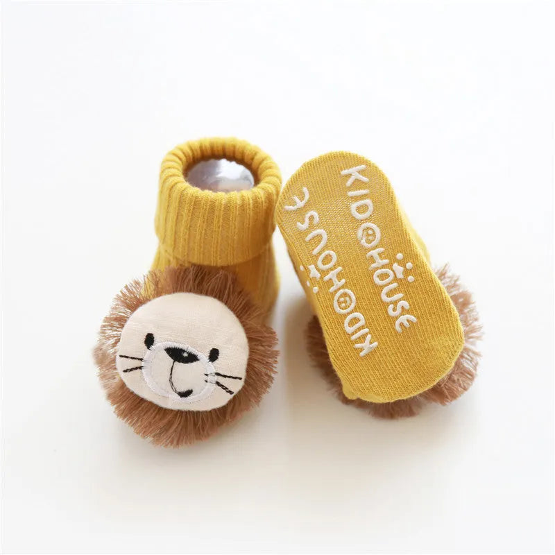 Cotton baby socks in multiple colours and prints including panda, lion, bows, and stars on a white background.