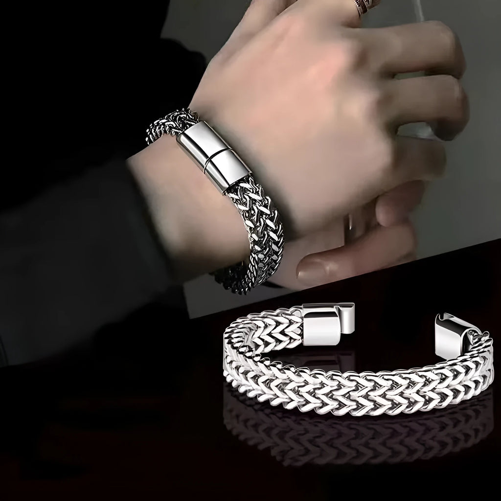 Men's geometric stainless steel bracelet showing front and back patterning with silver finish