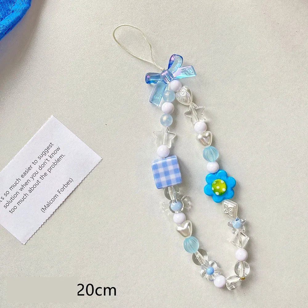 Yellow beaded flower mobile phone lanyard with hand rope design on wrist