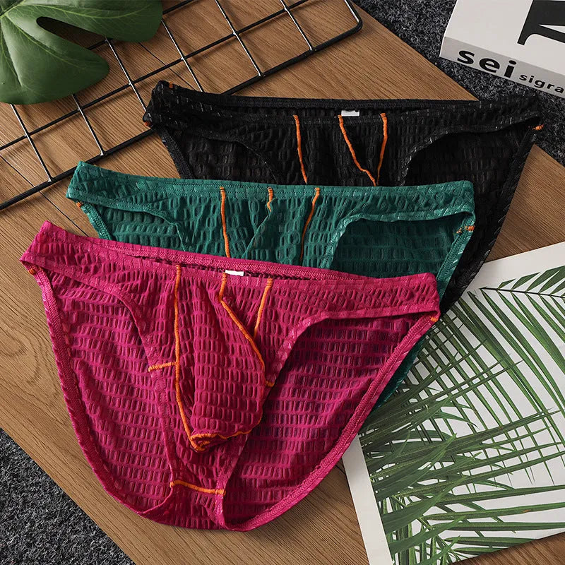 Men's low waist lace briefs in white, black, green, rose red, or light purple on a plain background.