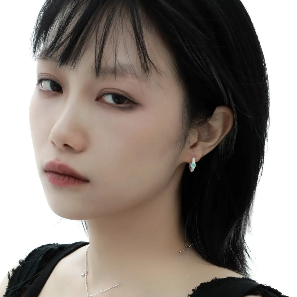 Geometric burnt silver ear clip for women with round elements made from 925 sterling silver